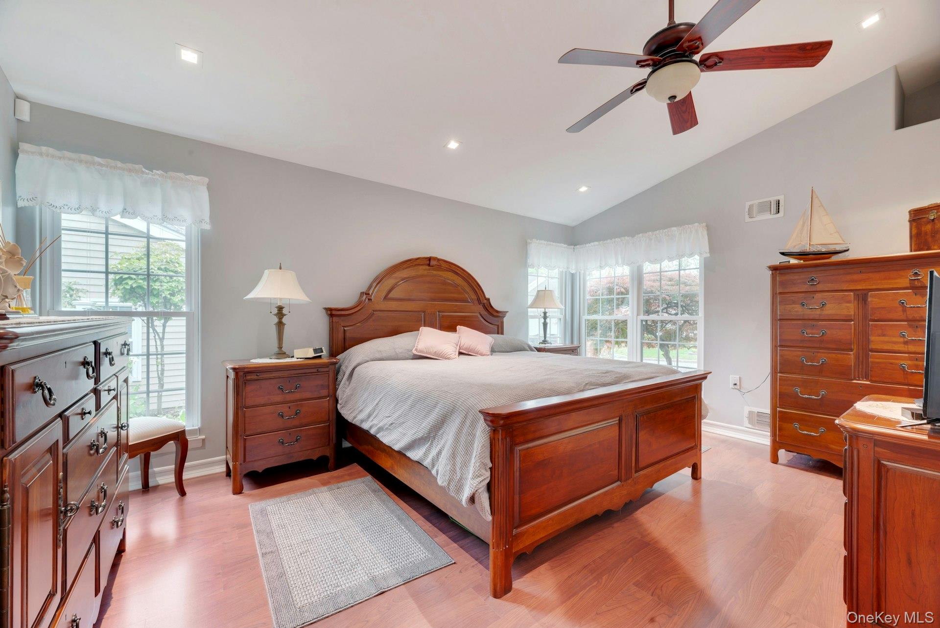 104 Glen Drive Ridge, NY 11961 - Photo 19 of 25 a bedroom with a bed and wooden floor