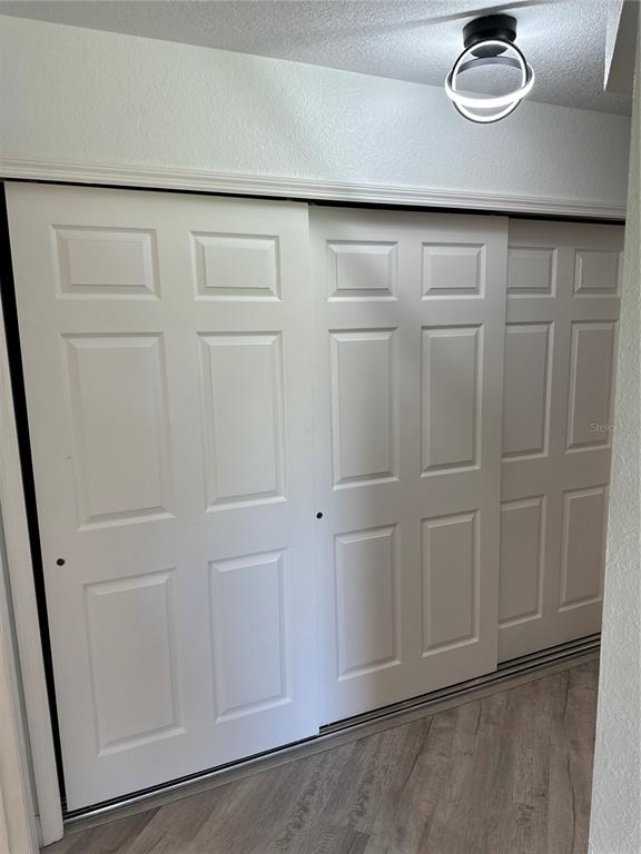 6967 Crown Drive, Unit B Englewood, FL 34224 - Photo 12 of 16 a close view of cabinet with washer and dryer