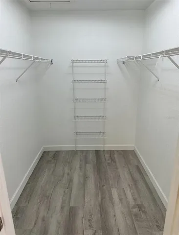 a view of a room with racks on the wall