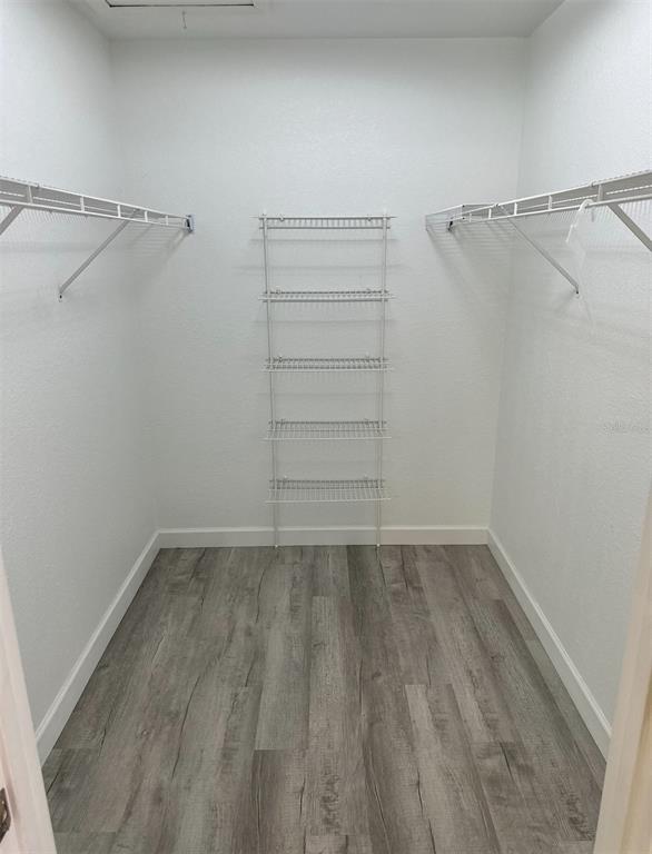 6967 Crown Drive, Unit B Englewood, FL 34224 - Photo 7 of 16 a view of a room with racks on the wall