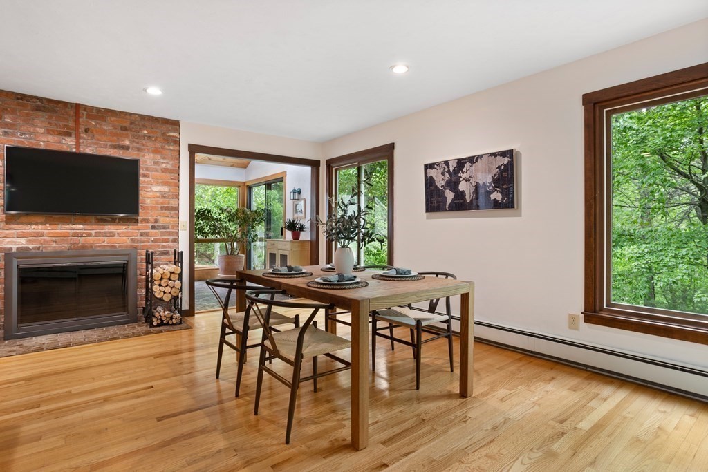 153 Green Road Bolton, MA 01740 - Photo 22 of 42 a view of a dining room with furniture window and wooden floor