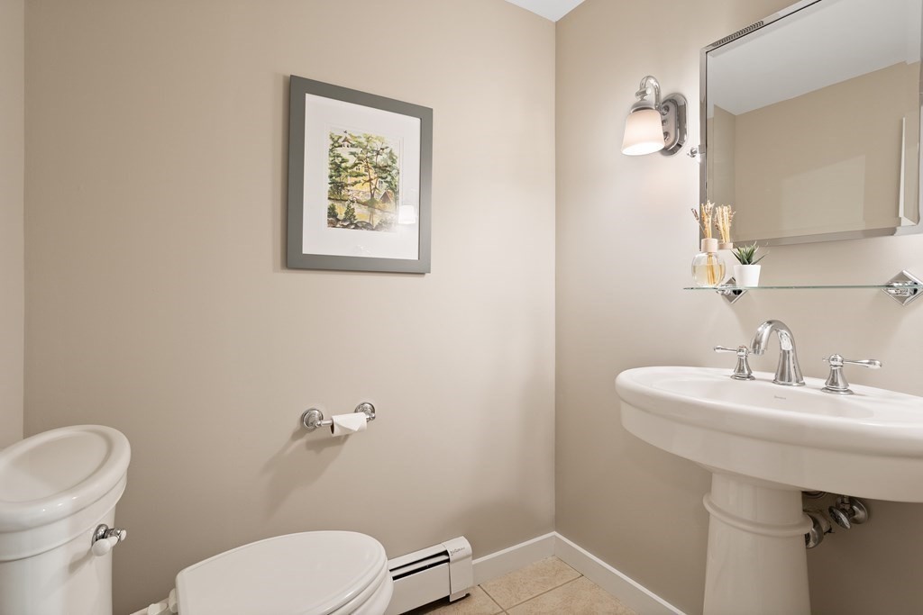 153 Green Road Bolton, MA 01740 - Photo 26 of 42 a bathroom with a toilet sink and mirror