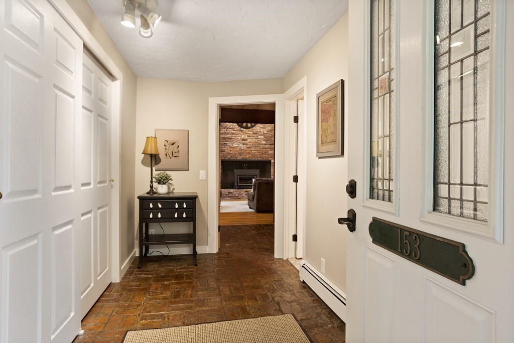 153 Green Road Bolton, MA 01740 - Photo 3 of 42 a hallway with windows and stairs
