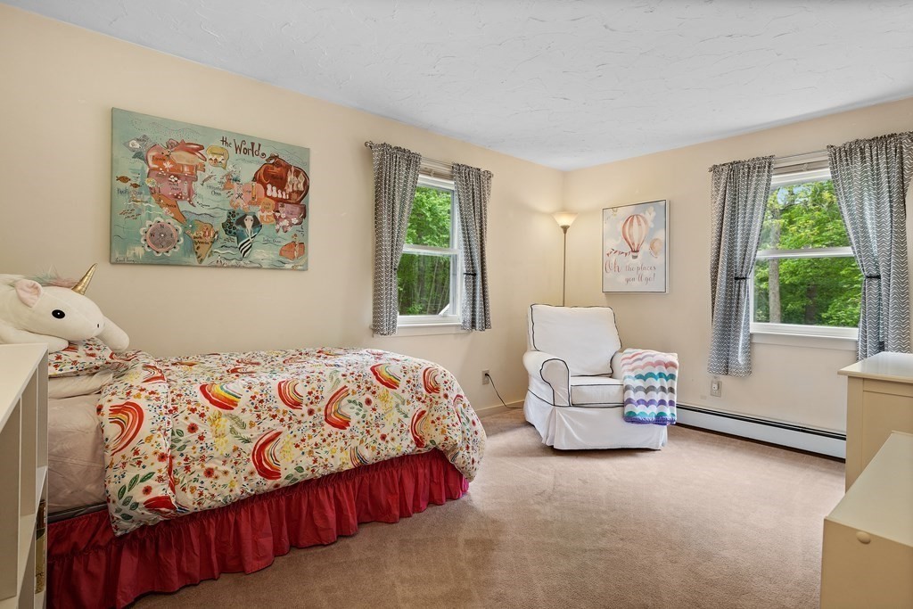 153 Green Road Bolton, MA 01740 - Photo 33 of 42 a bedroom with a bed and a couch