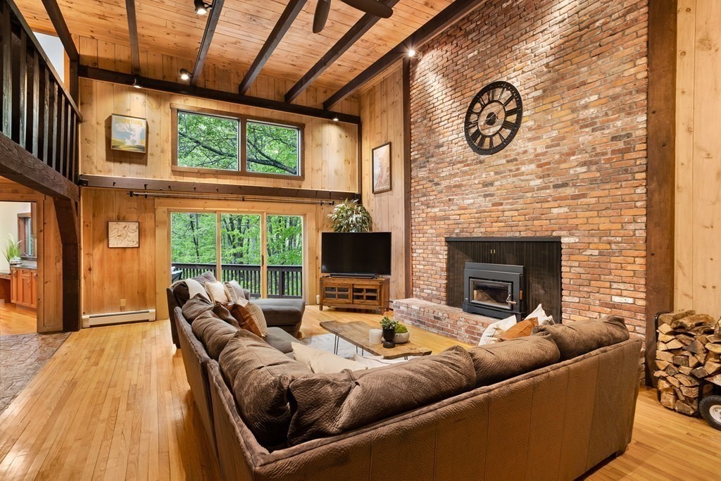 153 Green Road Bolton, MA 01740 - Photo 5 of 42 a living room with furniture and a fireplace