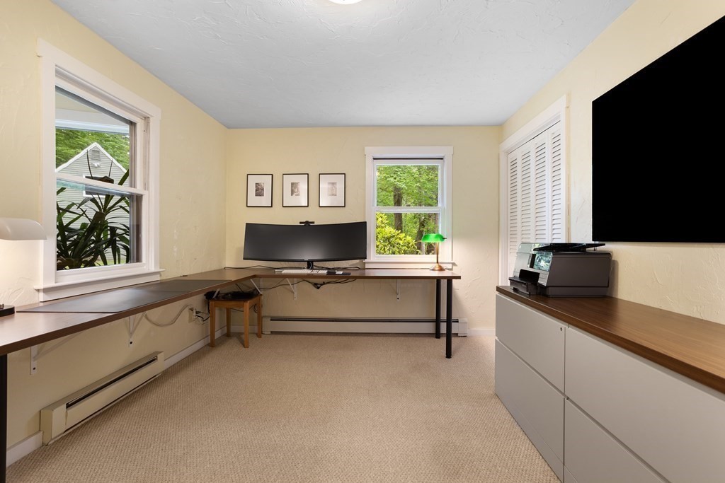 153 Green Road Bolton, MA 01740 - Photo 8 of 42 a living room with furniture and a flat screen tv