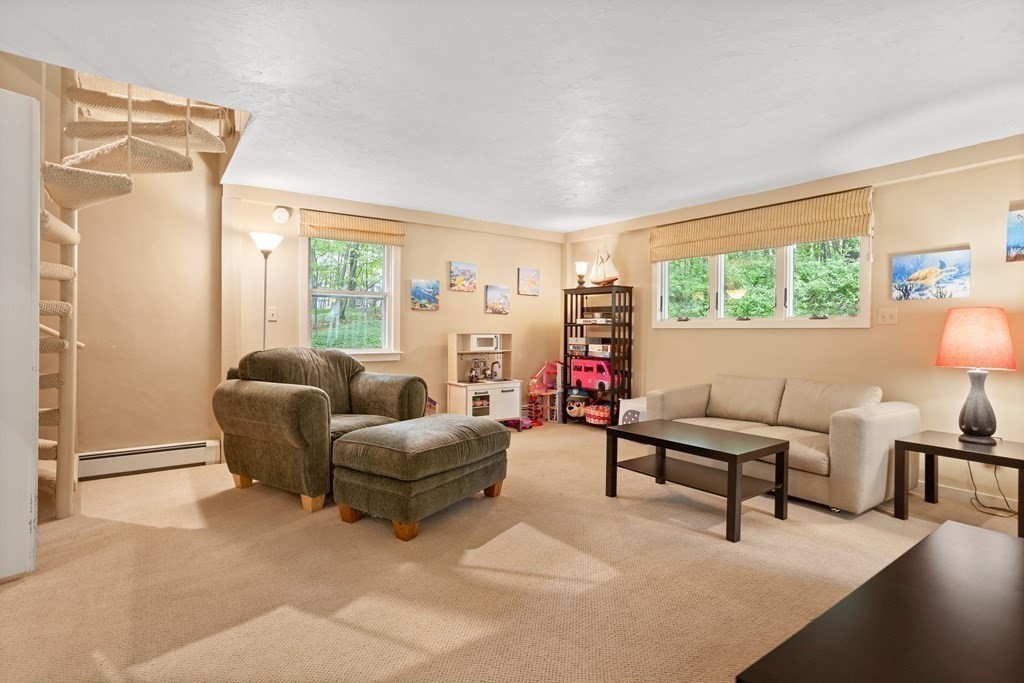 153 Green Road Bolton, MA 01740 - Photo 10 of 42 a living room with furniture and a window