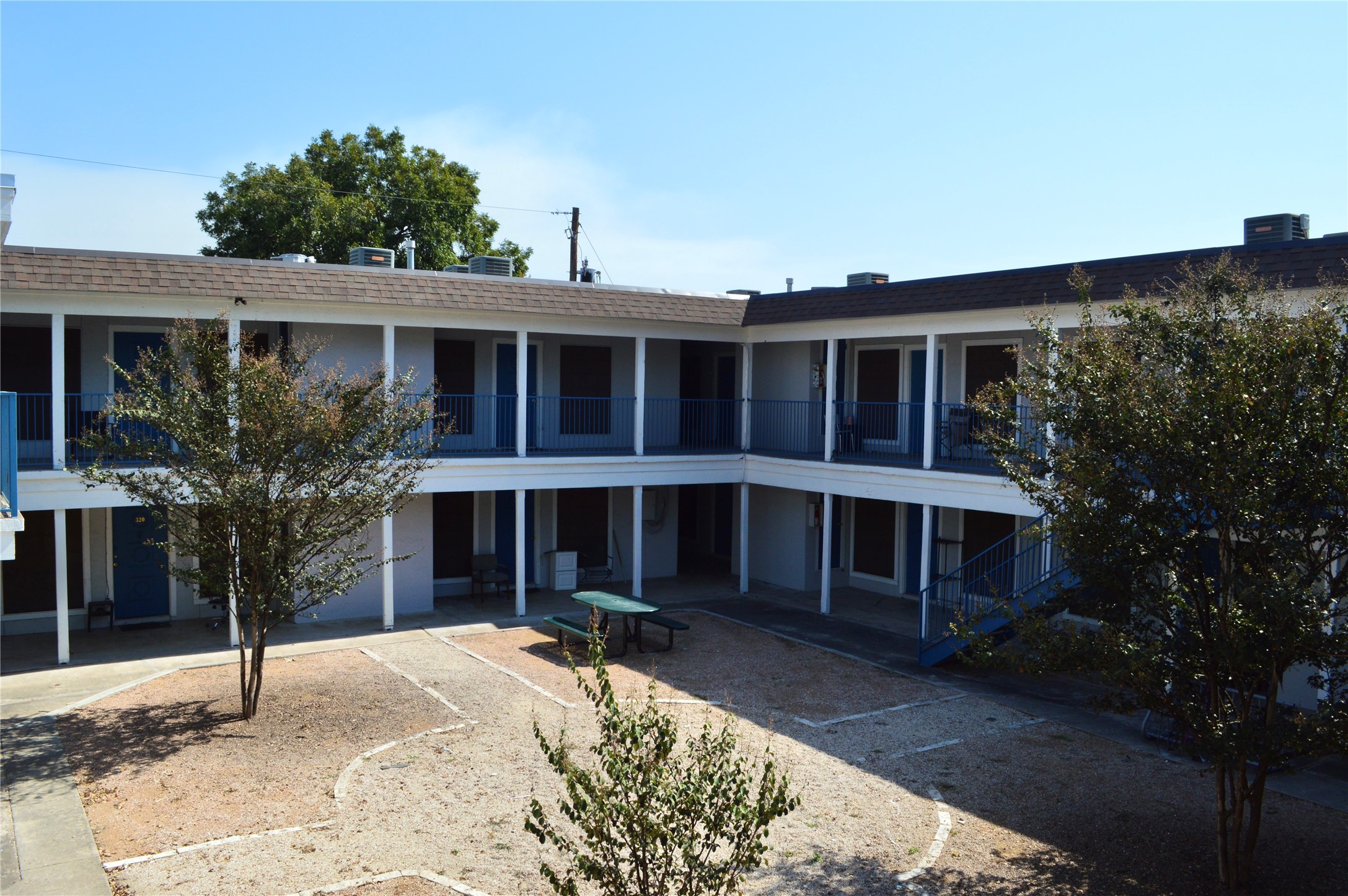 4709 Harmon Avenue, Unit 413 Austin, TX 78751 - Photo 2 of 11 a view of a house with a yard and plants