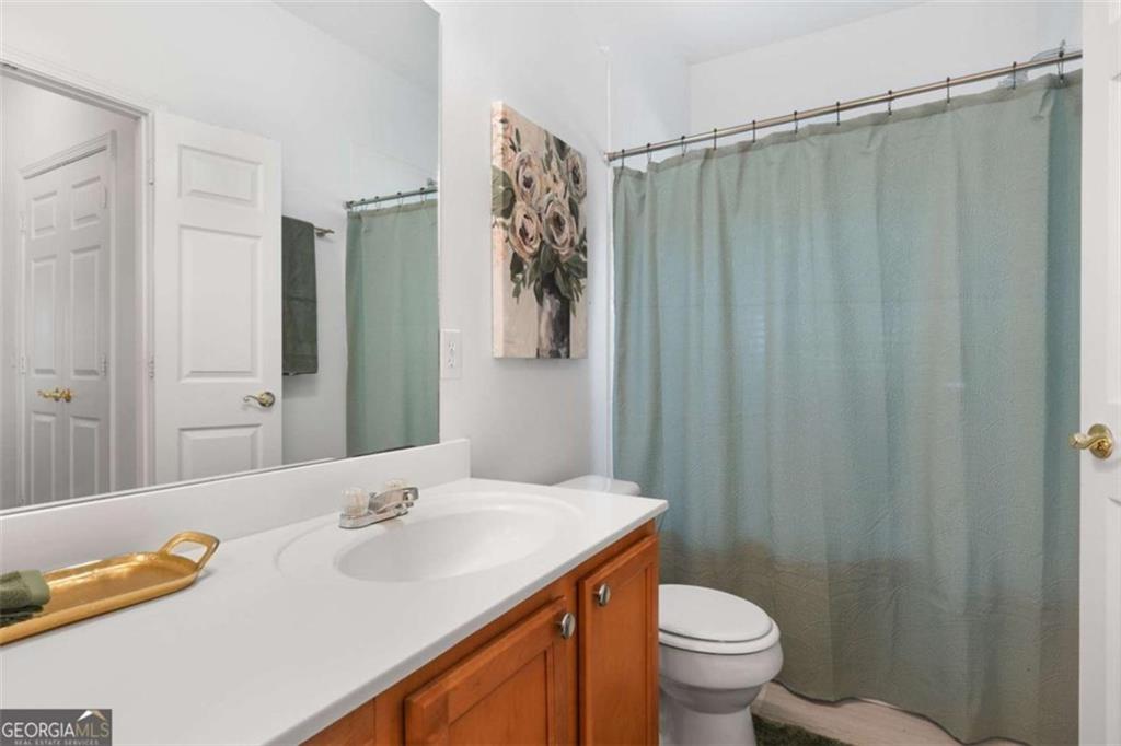 3309 Raes Creek Road Marietta, GA 30008 - Photo 30 of 39 a bathroom with a sink and a mirror