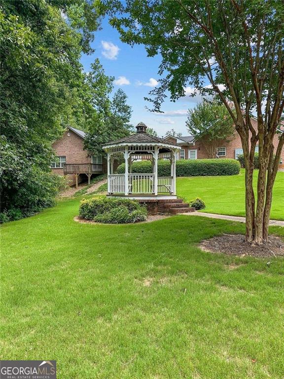 3309 Raes Creek Road Marietta, GA 30008 - Photo 35 of 39 a view of a house with a backyard