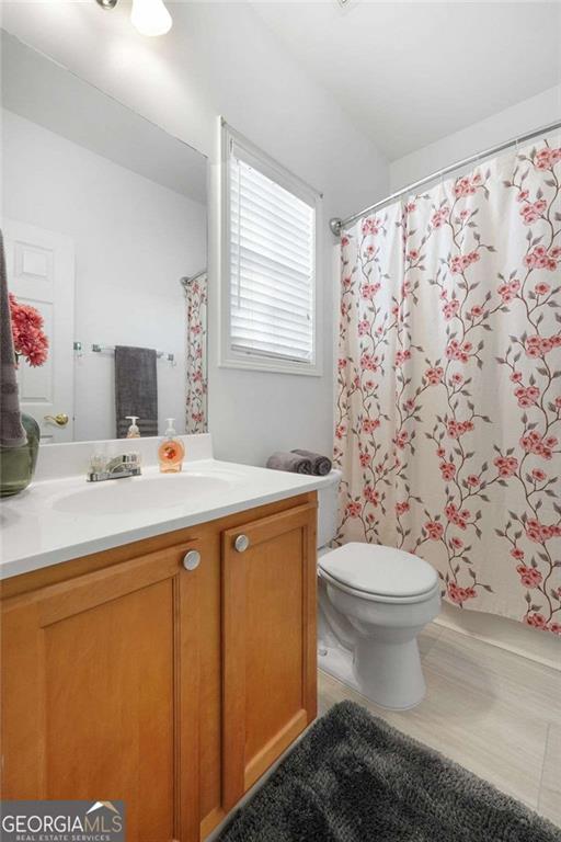 3309 Raes Creek Road Marietta, GA 30008 - Photo 8 of 39 a bathroom with a sink toilet and shower