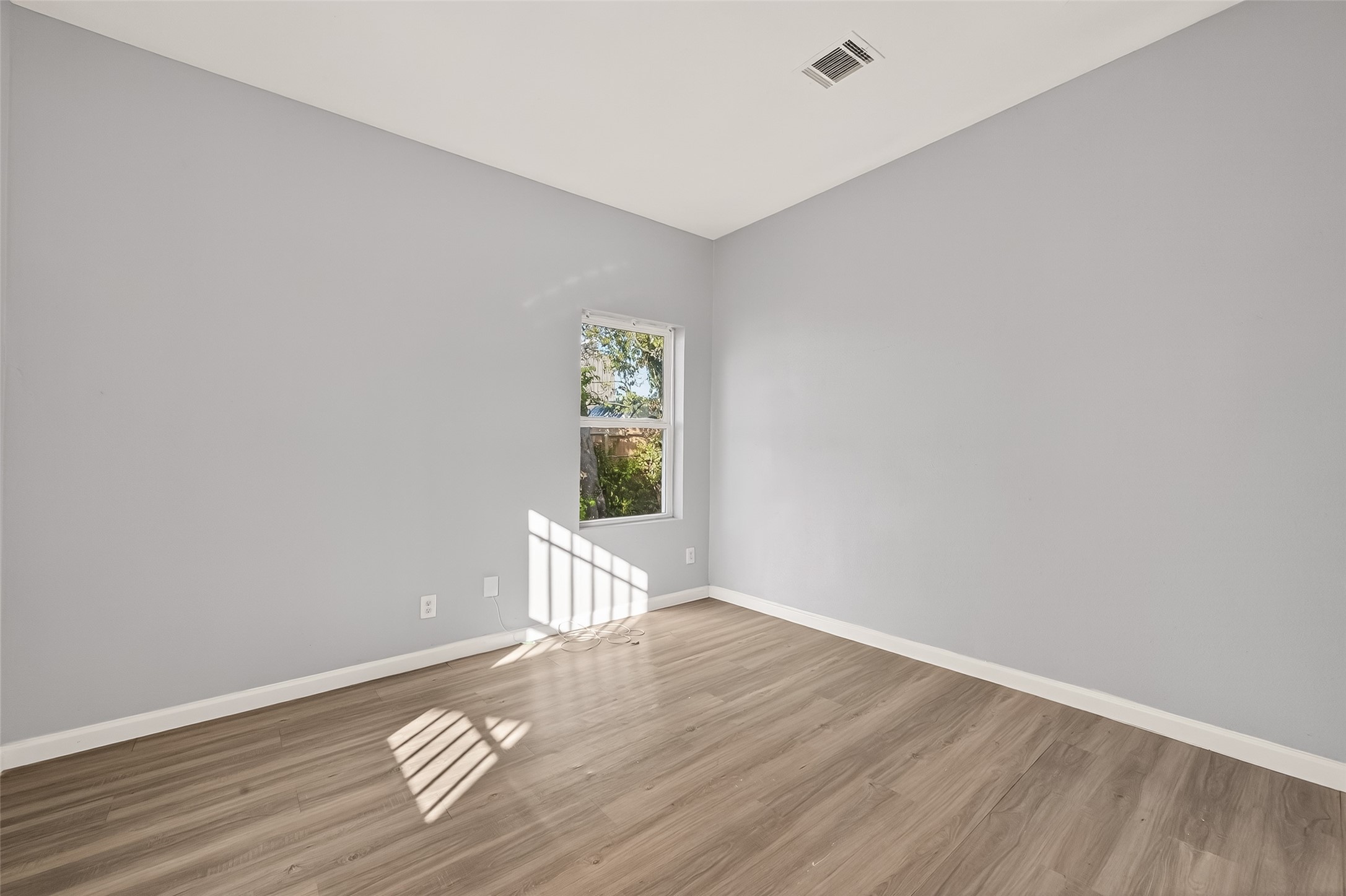 8211 Parnell Street Houston, TX 77051 - Photo 9 of 22 a view of wooden floor and windows in a room