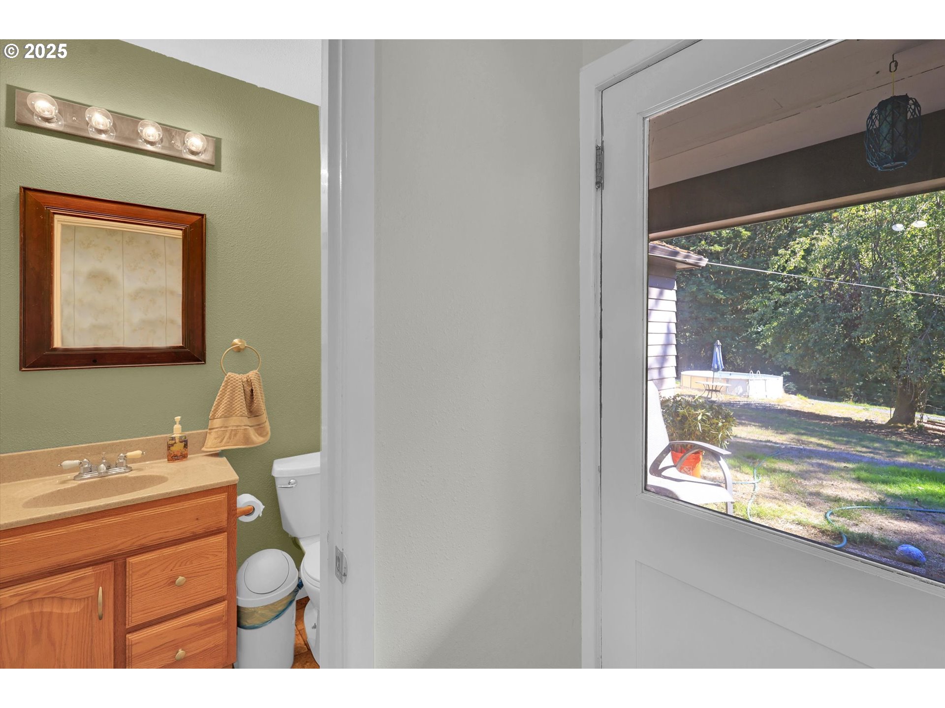 21076 Northwest Green Mountain Road Banks, OR 97106 - Photo 36 of 46 a bathroom view with a sink mirror and a window