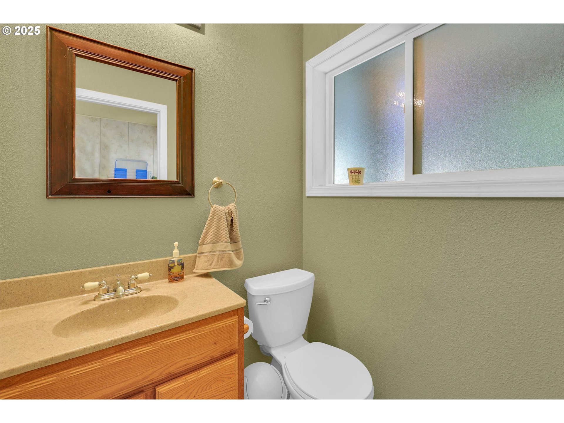 21076 Northwest Green Mountain Road Banks, OR 97106 - Photo 45 of 46 a bathroom with a toilet sink and mirror