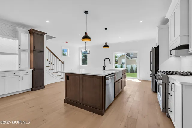 a view of a kitchen with a sink and dishwasher