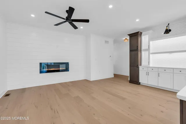 a kitchen with granite countertop a stove and a sink