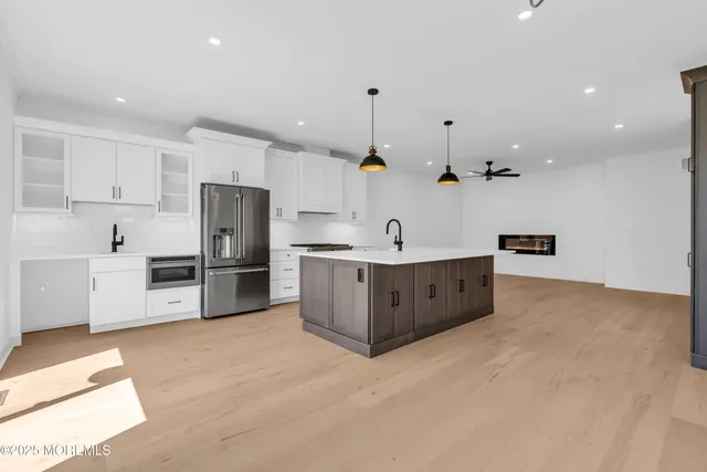 a view of an empty room with windows