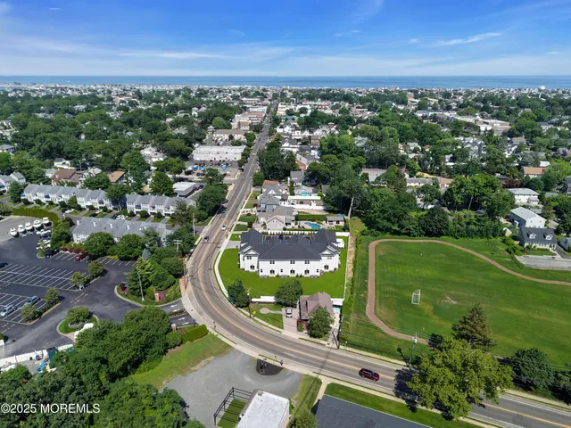 a view of house with outdoor space and parking space
