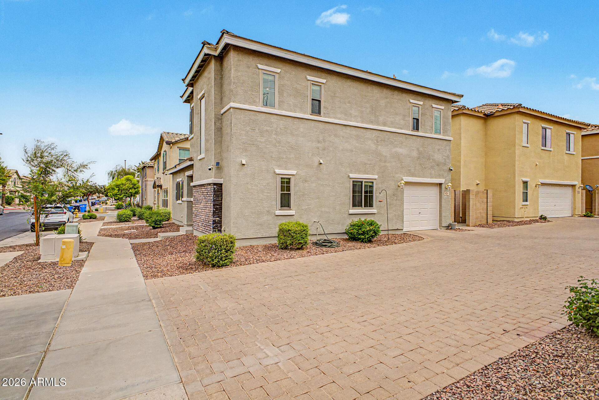 435 North Ranger Trail Gilbert, AZ 85234 - Photo 3 of 20 a front view of a house with a yard and potted plants