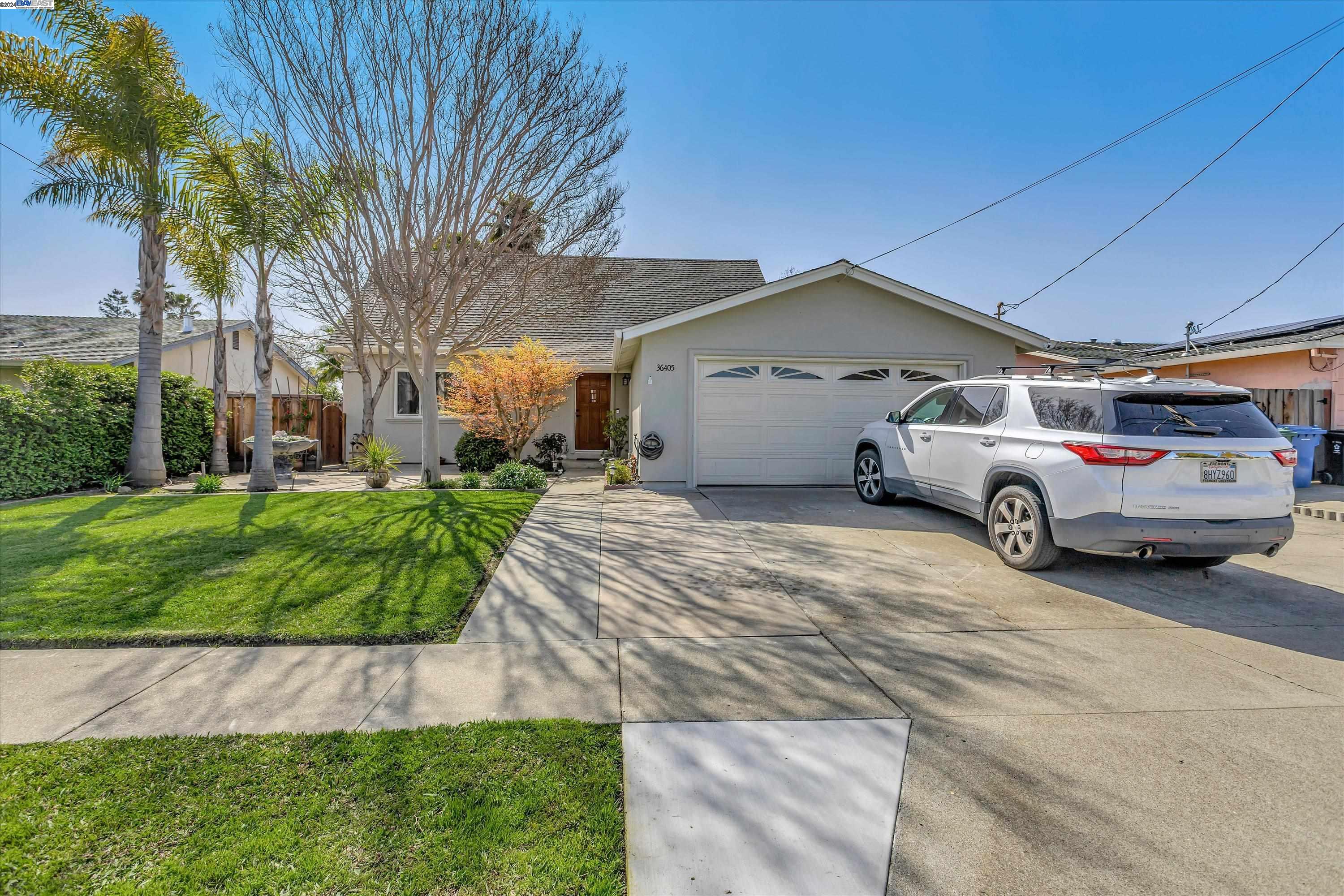 a car parked in front of a house