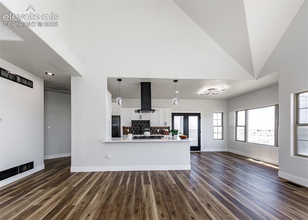 1120 Newton Road Pueblo, CO 81005 - Photo 6 of 46 a view of a kitchen with wooden floor and a window