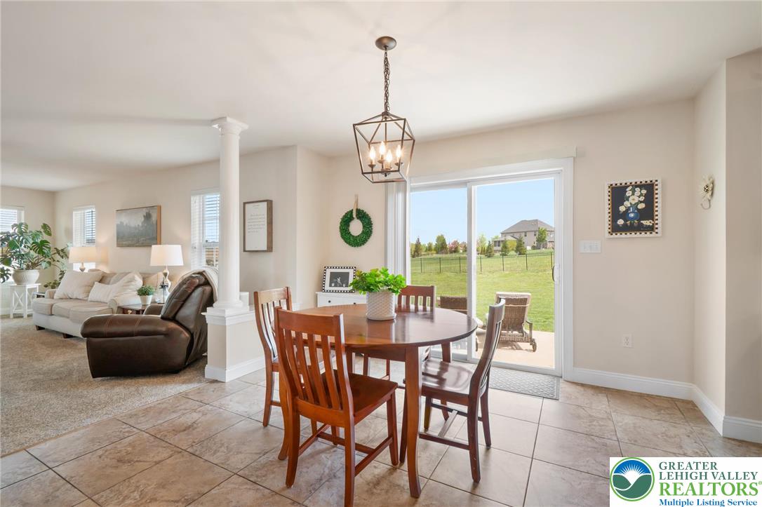 208 East Dell Road Bath, PA 18014 - Photo 12 of 40 a dining room with furniture a chandelier and a rug