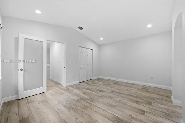 a view of bathroom with a sink and a mirror