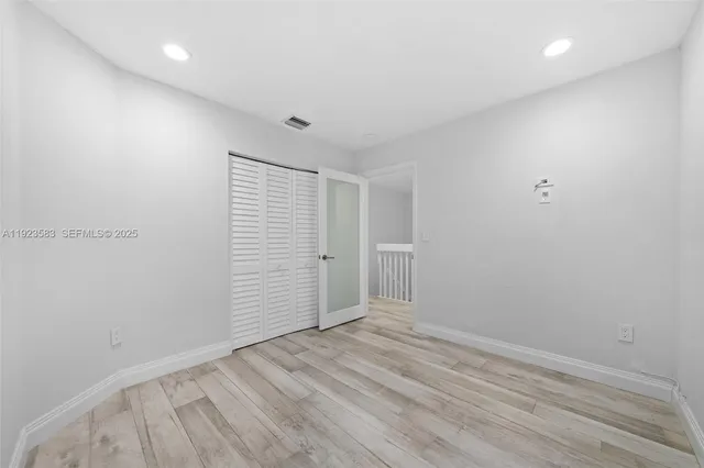 a bathroom with a sink toilet a mirror and shower