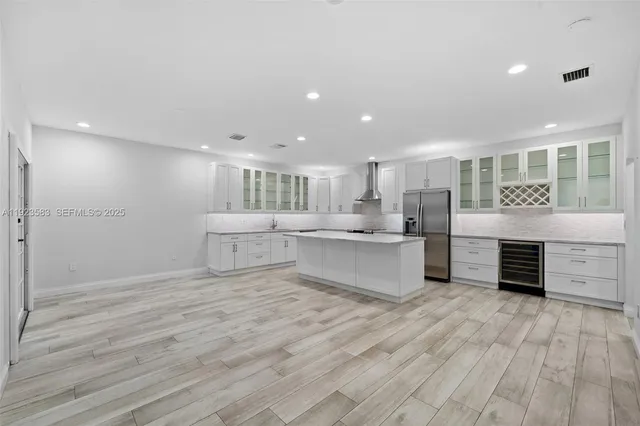 a kitchen with a sink stove and refrigerator