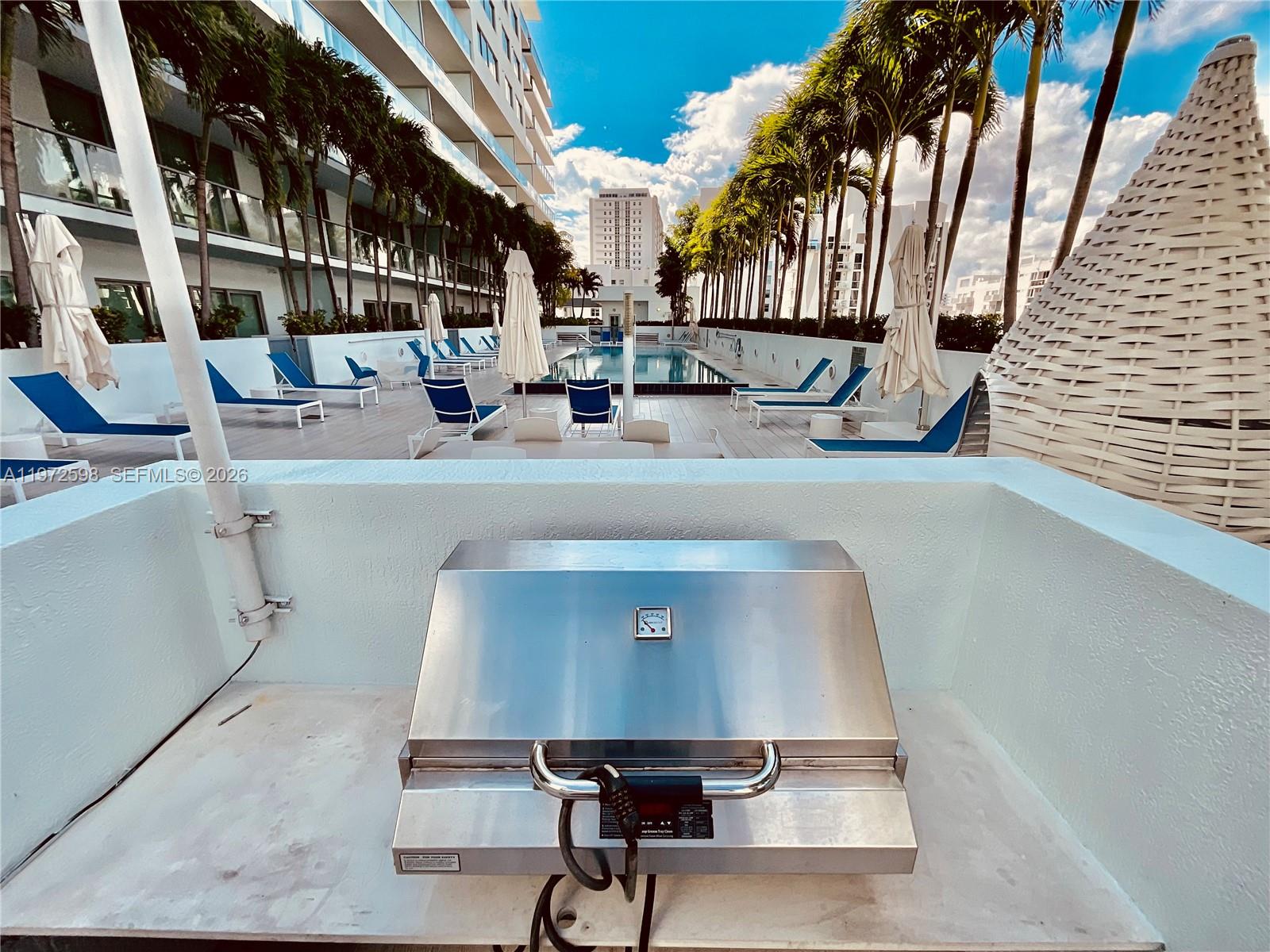 1600 Southwest 1st Avenue, Unit 1204 Miami, FL 33129 - Photo 18 of 75 a view of a chairs and table in a patio