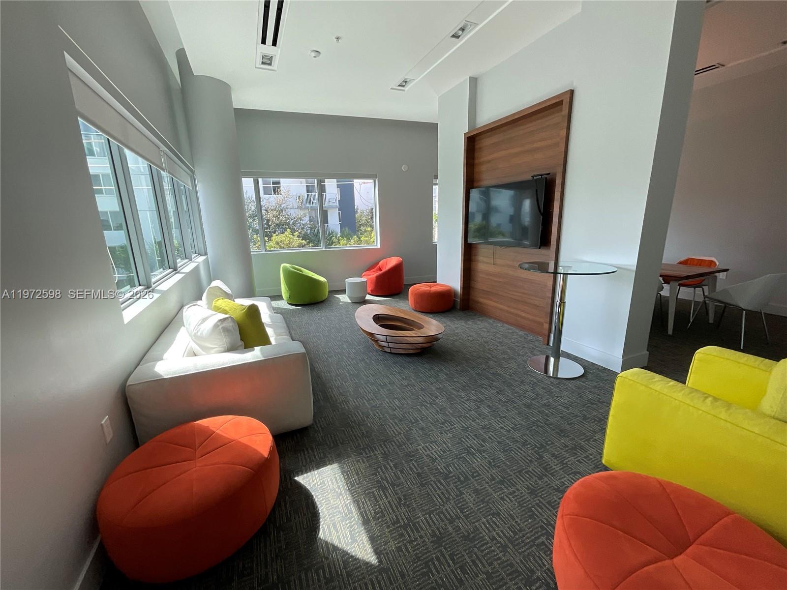 1600 Southwest 1st Avenue, Unit 1204 Miami, FL 33129 - Photo 40 of 75 a room with furniture and a large window