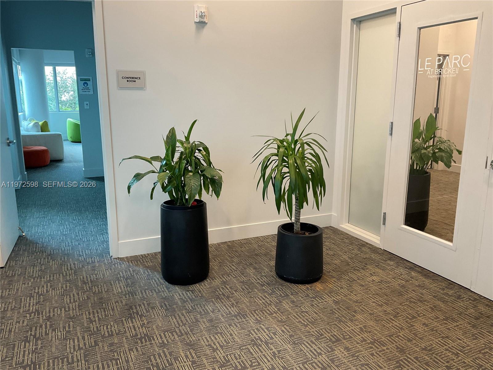 1600 Southwest 1st Avenue, Unit 1204 Miami, FL 33129 - Photo 41 of 75 a potted plant sitting in front of a bathroom
