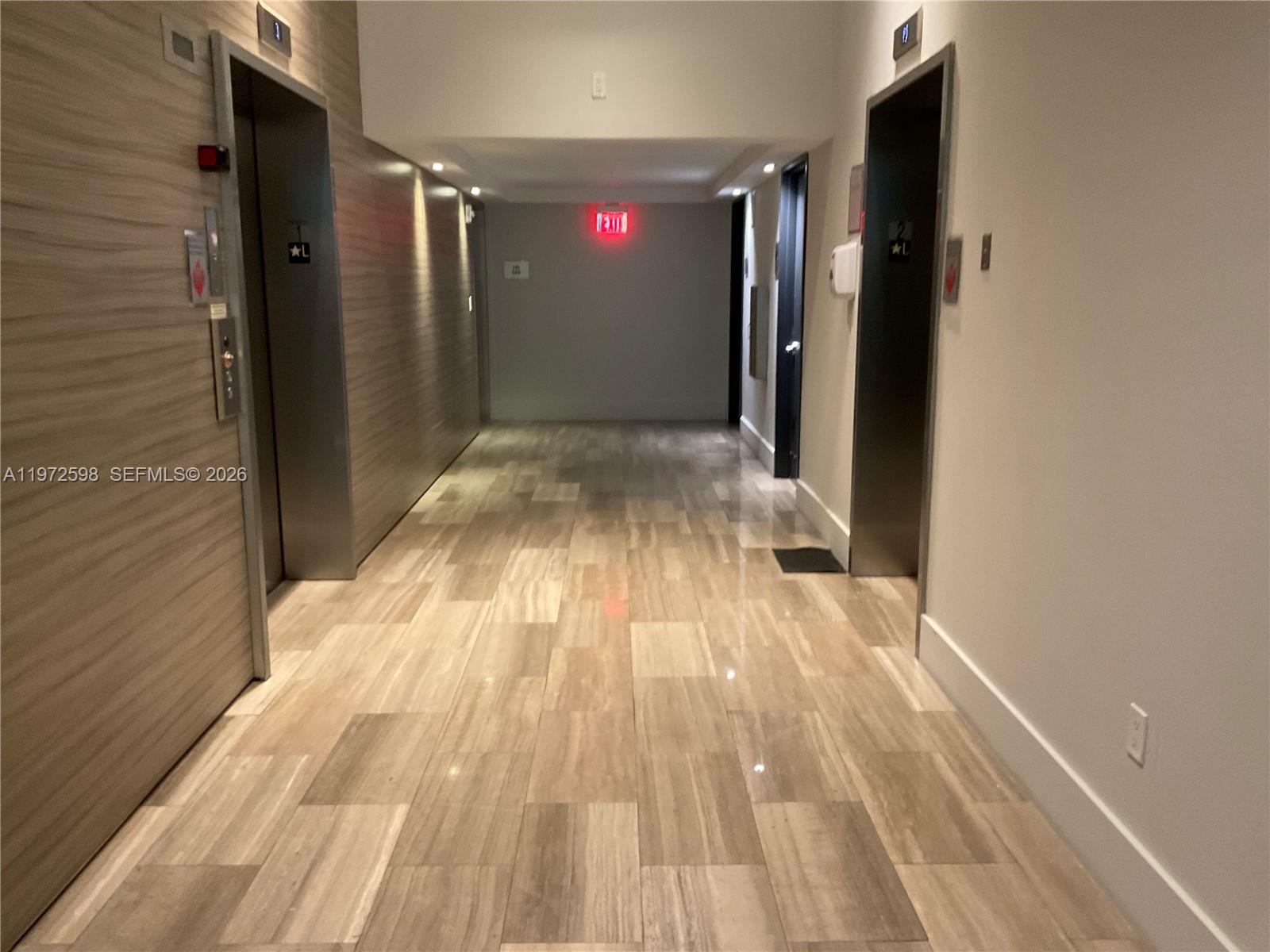 1600 Southwest 1st Avenue, Unit 1204 Miami, FL 33129 - Photo 43 of 75 a view of a hallway with wooden floor