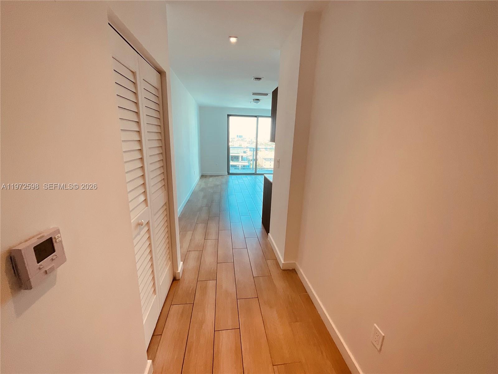 1600 Southwest 1st Avenue, Unit 1204 Miami, FL 33129 - Photo 65 of 75 a view of a bathroom from the hallway
