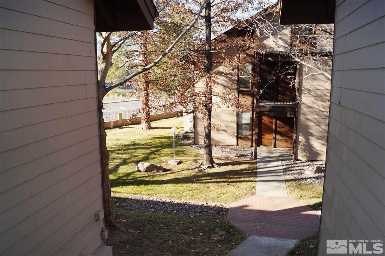 1465 East Peckham Lane, Unit 68 Reno, NV 89502 - Photo 1 of 1 a view of swimming pool with a yard