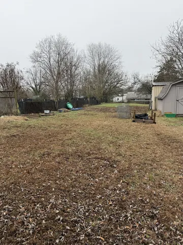a view of a yard with a slide
