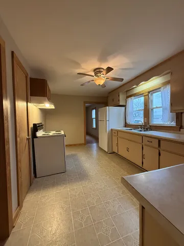 a view of a kitchen with appliances and cabinets