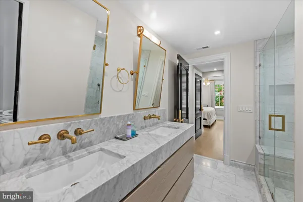 a bathroom with a double vanity sink and mirror
