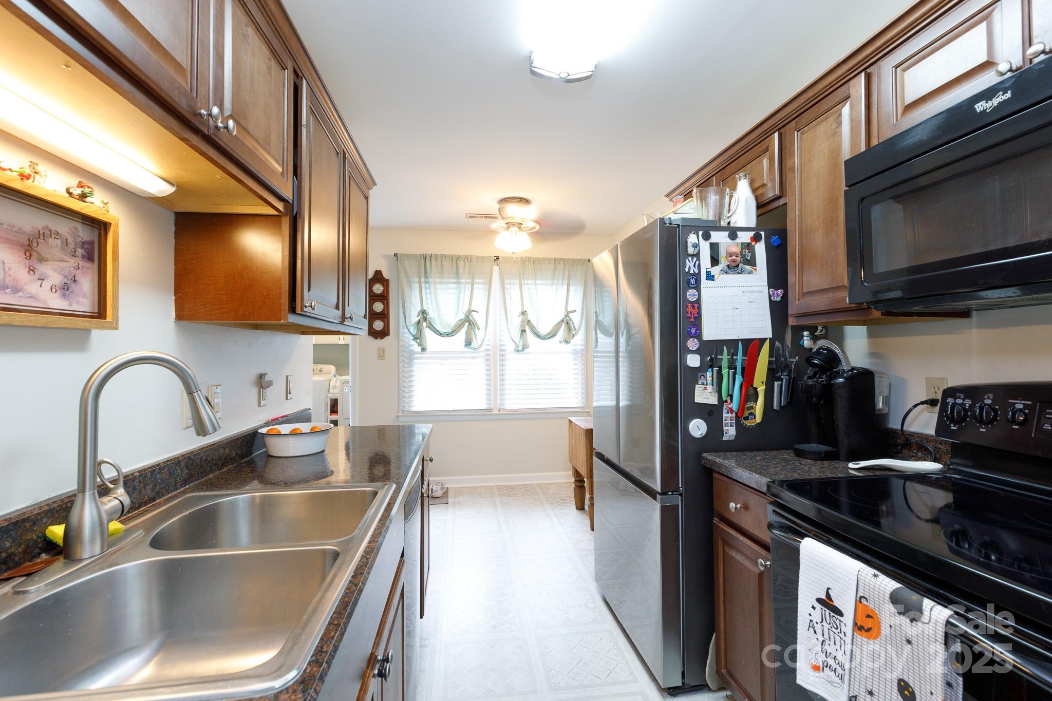 1246 India Hook Road Rock Hill, SC 29732 - Photo 7 of 21 a kitchen with granite countertop a sink and a stove top oven