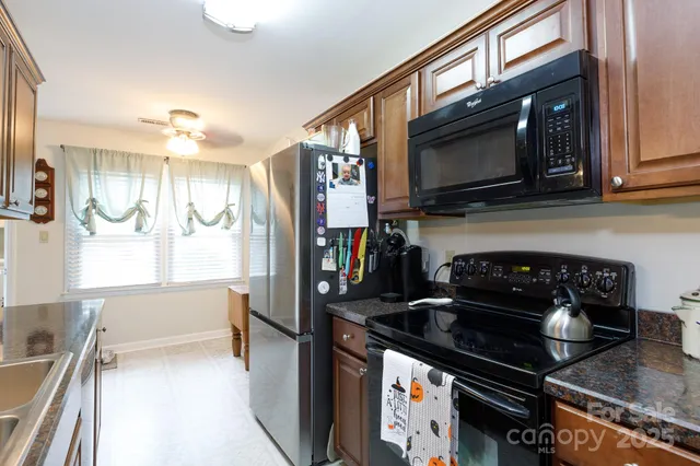 a kitchen with a stove and a microwave