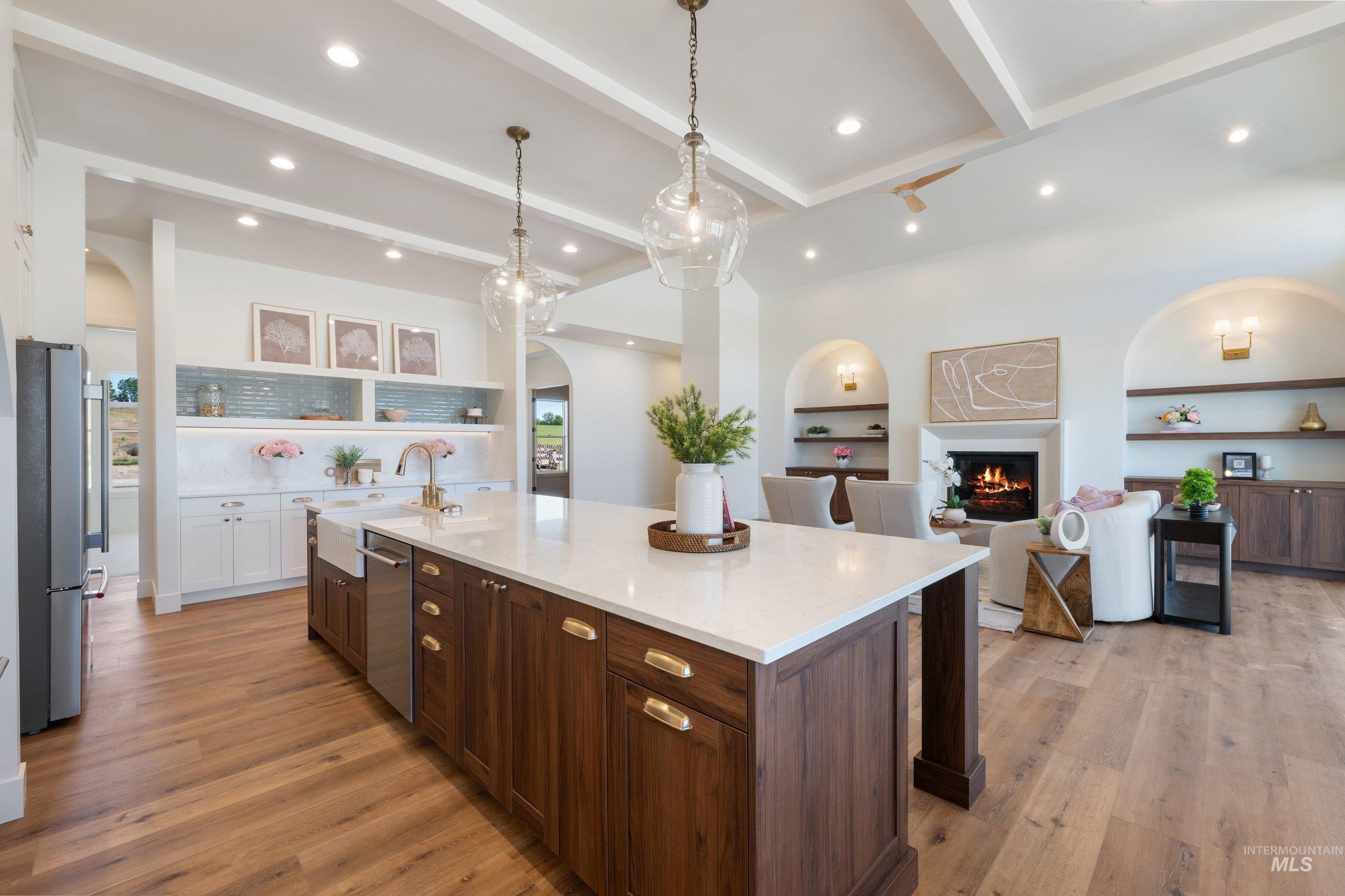 24821 Ardmore Court Caldwell, ID 83607 - Photo 14 of 43 Expansive kitchen island with a white countertop and wood-finish cabinetry