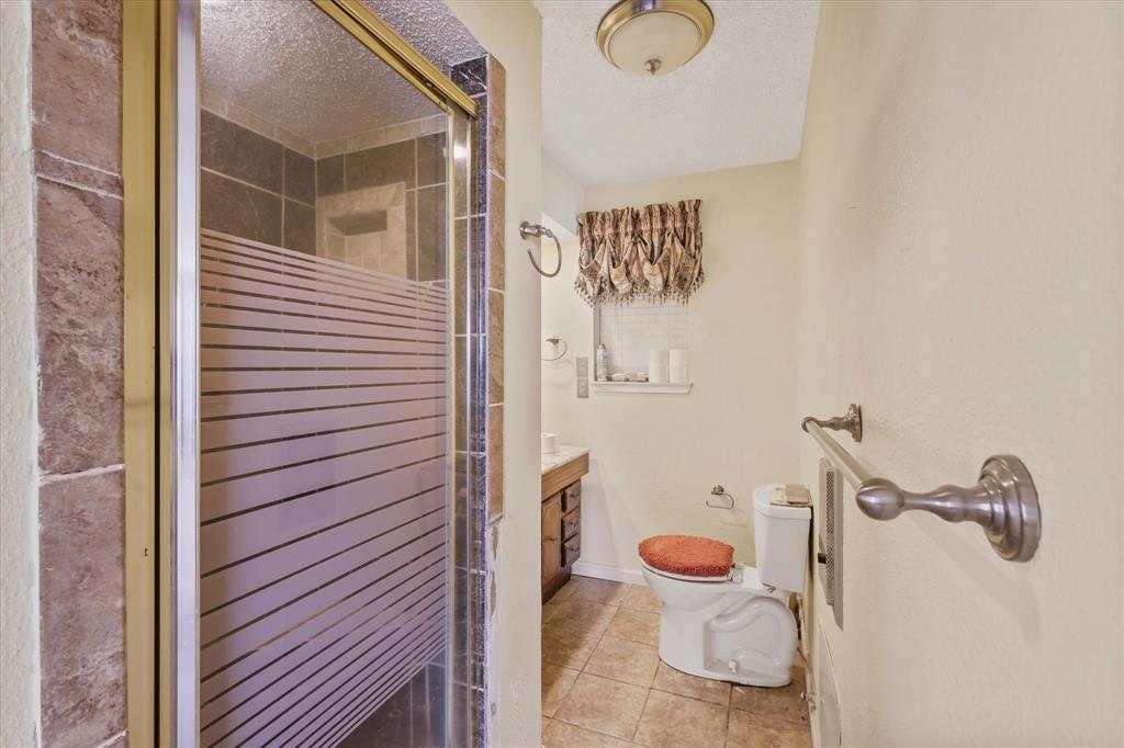 531 Private Road 4721 Rhome, TX 76078 - Photo 11 of 20 a bathroom with a toilet and shower