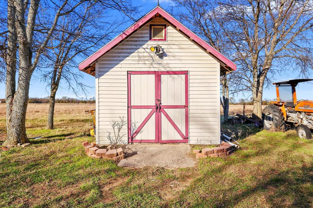 531 Private Road 4721 Rhome, TX 76078 - Photo 20 of 20 a view of a house with a yard