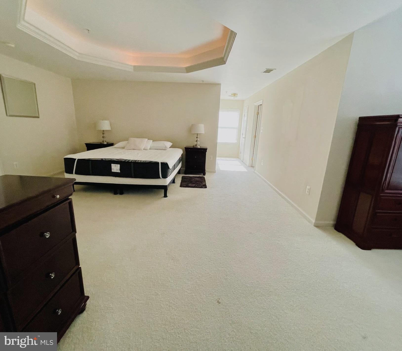 14613 Farnham Lane Laurel, MD 20707 - Photo 16 of 29 a bedroom with a bed and a tv