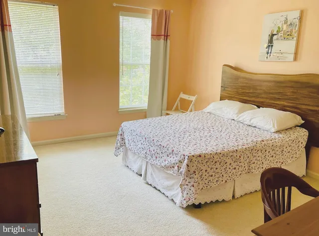 a bedroom with a bed and dresser