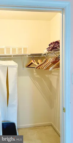 a view of a balcony with floor to ceiling windows with wooden floor