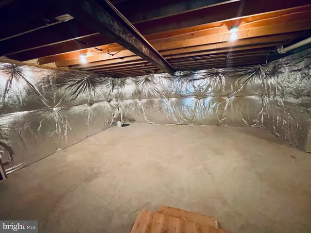 a view of walk in closet with clothes