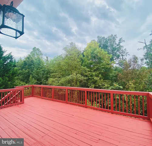 a view of balcony with wooden floor