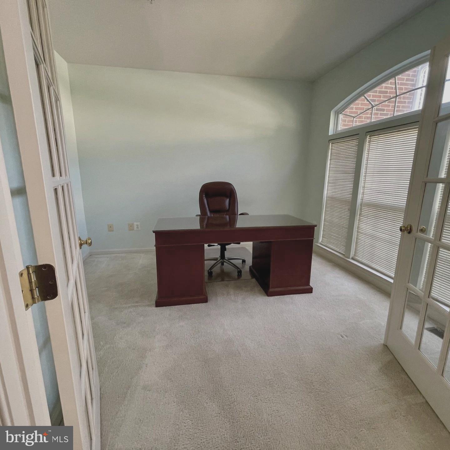 14613 Farnham Lane Laurel, MD 20707 - Photo 6 of 29 a living room with furniture and a gate