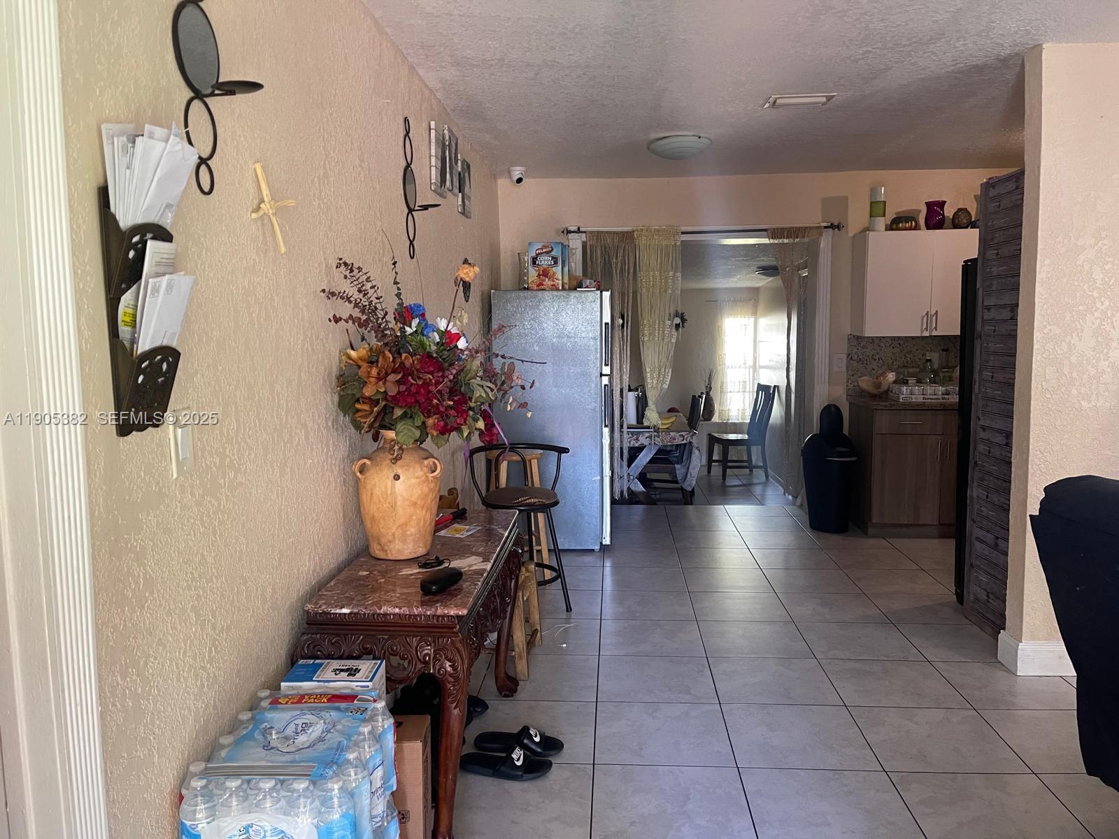 665 Northwest 153rd Street Miami, FL 33169 - Photo 17 of 28 a view of entryway with livingroom